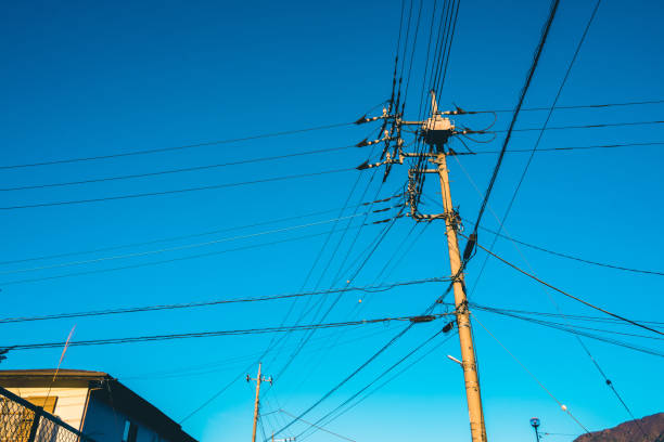 the electricity post with many line and blue sky.