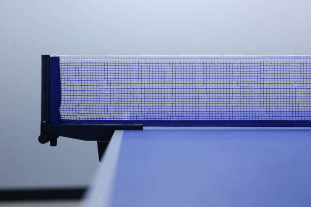 Blue ping pong net with blurred background. Blue table tennis net on ping pong table.