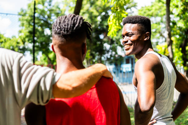 istock Young athletes men talking and walking on a public park 2171352028
