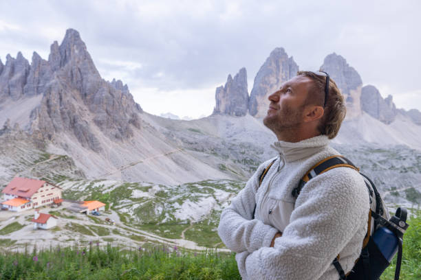istock Hiker admiring mountain peaks in the Dolomites 2171355861
