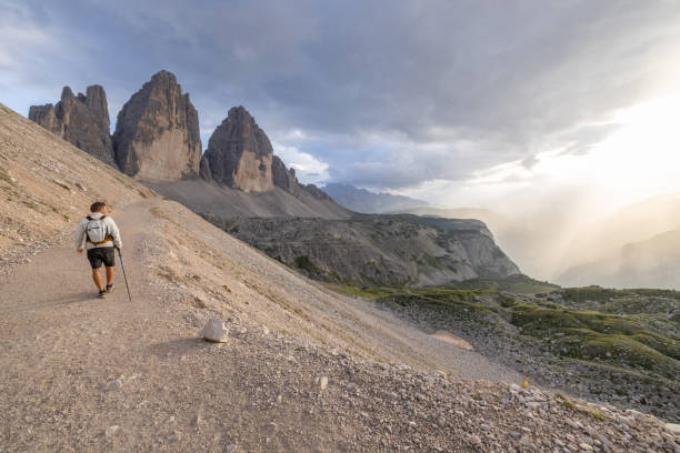 istock Solo hiker walking on a mountain trail in the Dolomites 2171356000