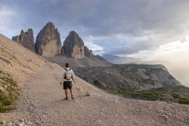 istock Hiker walking on a mountain path in the Dolomites at dusk 2171356170