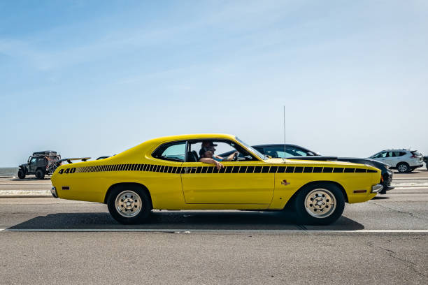 Gulfport, MS - October 04, 2023: Wide angle side view of a 1971 Dodge Demon 440 Sport Coupe at a local car show.