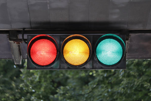Horizontal traffic light Horizontal traffic light with all lights illuminated, seen from the front. blue yellow lights stock pictures, royalty-free photos & images