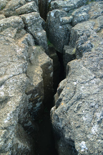 A fissure between the North American and Eurasian tectonic plates at pingvellir National Park, Iceland, showing the rugged natural rock formations