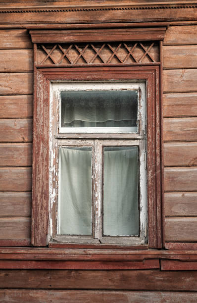 istock Old wooden window on the ancient abandoned house 2171363135