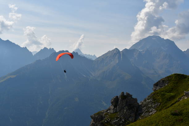 istock Paragliding above Stubai Valley in Tirol 2171365416