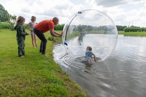 istock Outdoor fun with inflatable ball on lake 2171366930