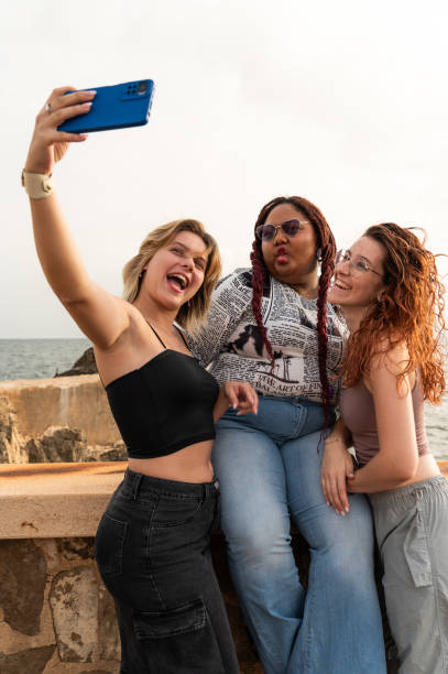 istock Friends taking selfie on the seaside enjoying summer 2171368721