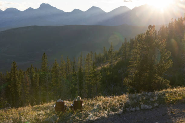istock Mature women watch sunset over mountains 2171372078