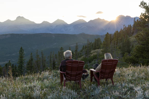 istock Mature couple watch sunset over mountains 2171372315