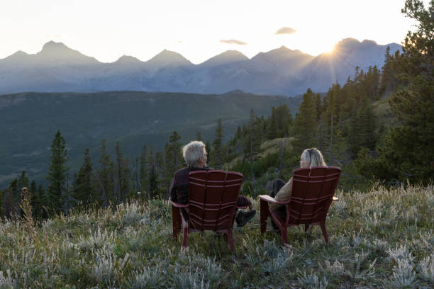 istock Mature couple watch sunset over mountains 2171372316