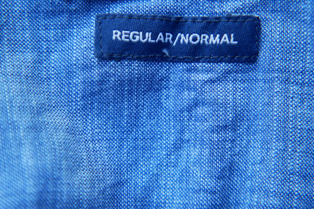 istock A CloseUp Image of a Blue Fabric Label That Clearly Reads REGULARNORMAL on It 2171373274