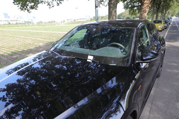 istock car with a parking ticket 2171376060