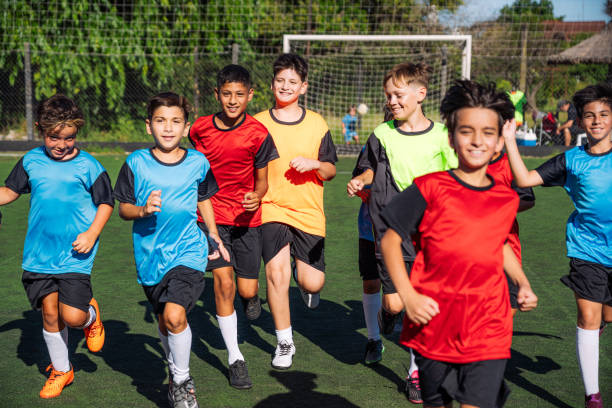 istock Junior football team running on the field 2171379197