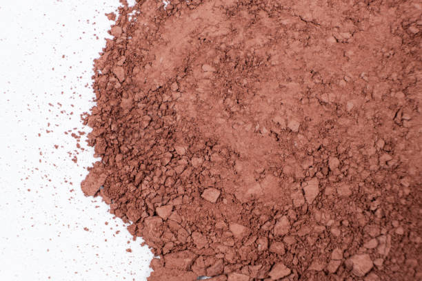 istock Scattered brown eyeshadow on a white background. Eye shadow texture 2171381389