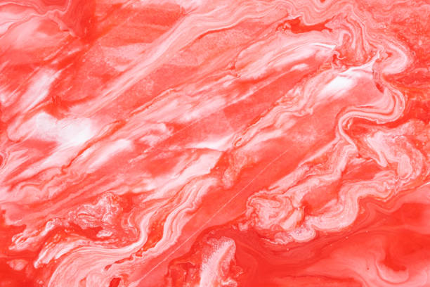 istock Abstract background mixing red and white paints. 2171381392