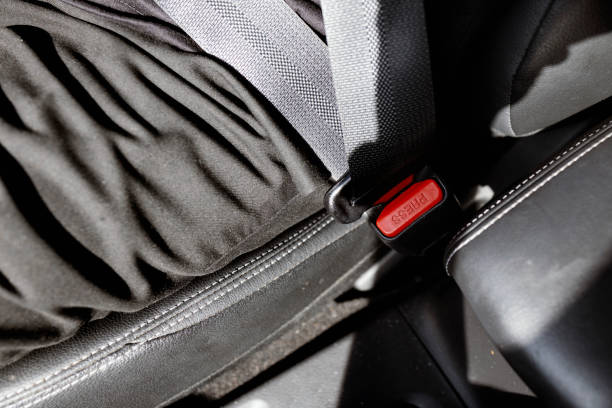 istock Close-up hand man driver fastens seat belt. 2171381913