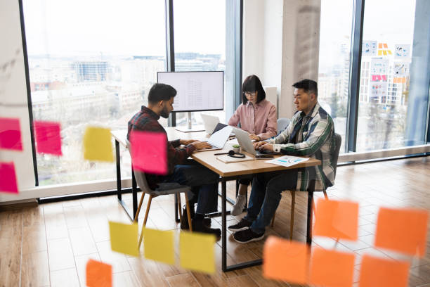 istock Team collaboration meeting in modern office with sticky notes 2171383133