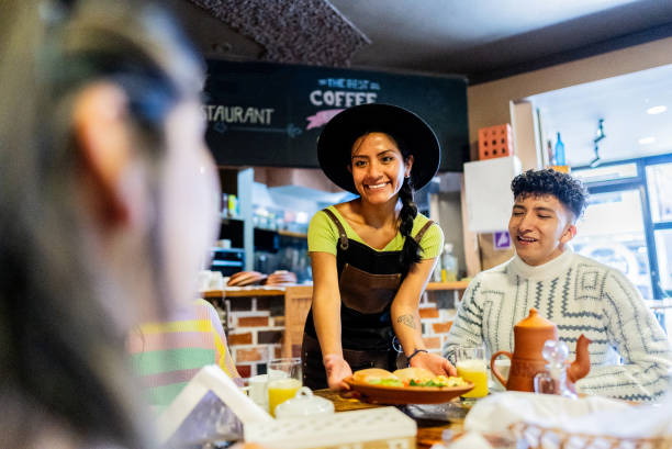 istock Waitress serving customers on a hotel restaurant 2171389290