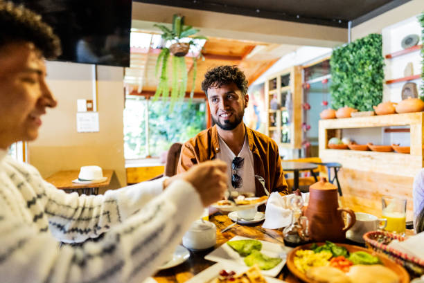 istock Friends talking on hotel restaurant 2171389838