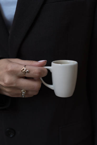 Young, upscale businesswoman with espresso cup, Trieste