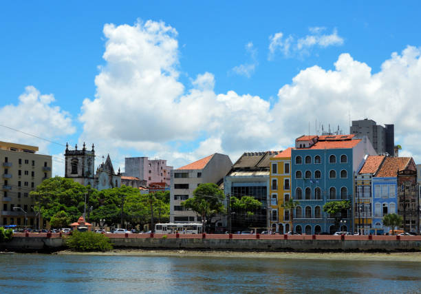 Recife, Pernambuco, Brazil: Capibaribe River and buildings on the embankment along Martins de Barros Avenue - Holy Spirit Church and Dezessete Square on the left - Santo Antonio district.