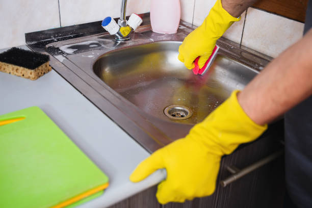 istock Cleaning Metal Sink with Gloves in Kitchen 2171400102