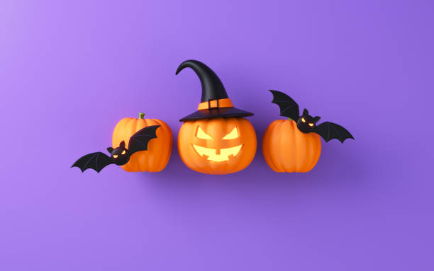 istock Jack-o-Lantern pumpkins and bats on purple background 2171400996