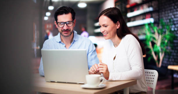 istock Coworkers Using Technology Lifestyle. Man And Woman Drinking Coffee 2171402685