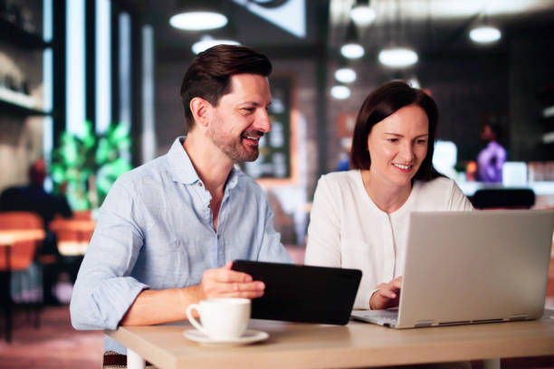istock Coworkers Using Technology Lifestyle. Man And Woman Drinking Coffee 2171402689