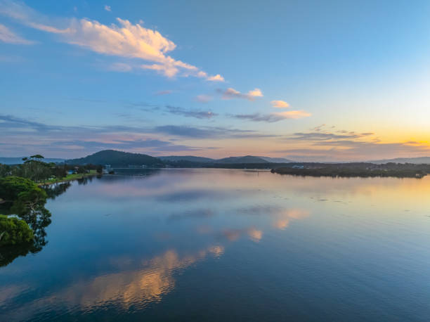 istock Sunrise along the waterfront with reflections on the bay water 2171403403