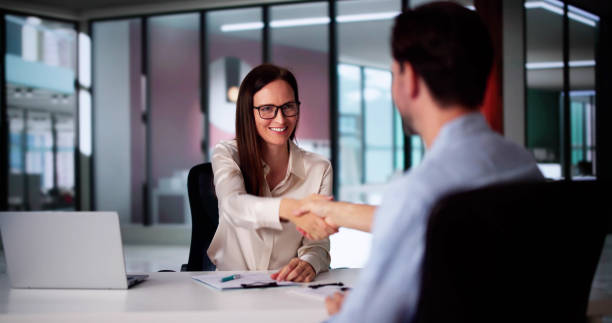istock Business Partners Shake Hand In Office 2171404389