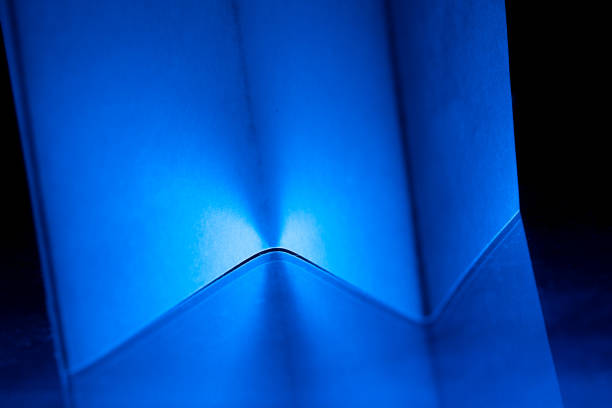 Curved shapes in vibrant blue and black blend together harmoniously, creating an engaging abstract composition that invites the viewer to explore textures and colors.