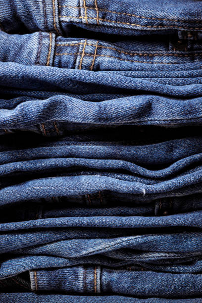 istock Texture of blue denim. Denim machine stitch. Factory tailoring. 2171413686
