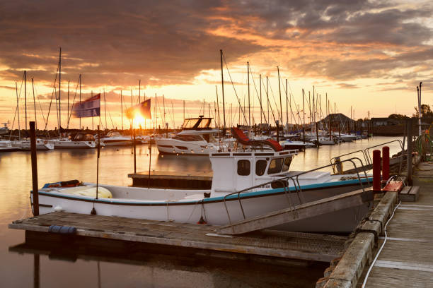 Canada, Shediac - August 22, 2024: Shedia harbor with tour boats and fishing boats at sunrise. Shediac is considered as one of the most important Acadian region and of course, the lobster capital