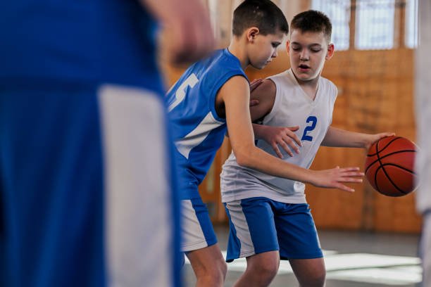istock Basketball player defending against opponent 2171430238