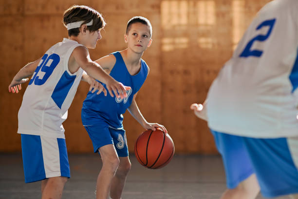 istock Young basketball player defending against rival 2171430243