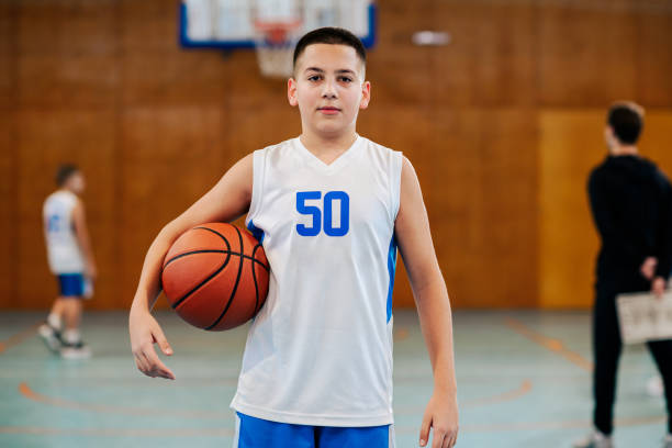 istock Casual pose with basketball on court 2171430259