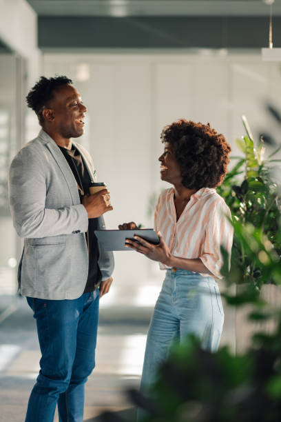 istock Diverse casual executives with tablet collaborating on a report at office 2171430270