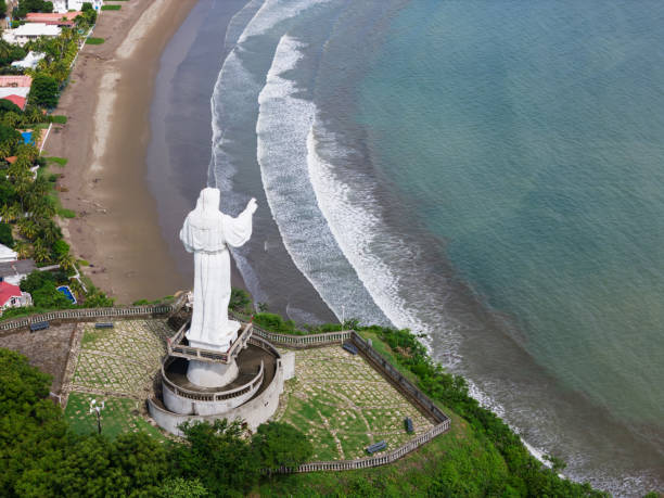 istock Jesus christ statue monument on green sea background 2171431688