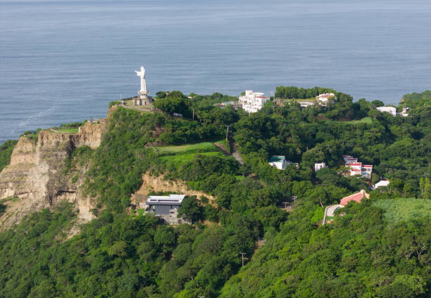 istock Jesus christ statue monument on top of green hill 2171431703