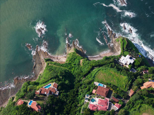 istock Luxury villas on green tropical waterfront 2171431717