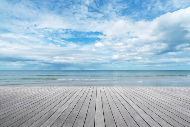 Empty wooden terrace beside sea shore