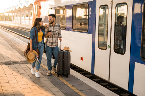 istock Young couple going on a vacation on train station. 2171436654