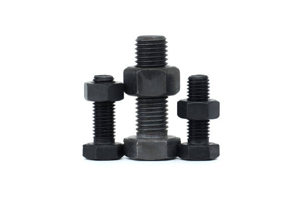 Stainless steel hex bolt and nut on a wooden Surface vertical set.