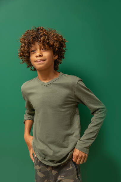 istock Beautiful young black boy posing for studio portrait 2171441161