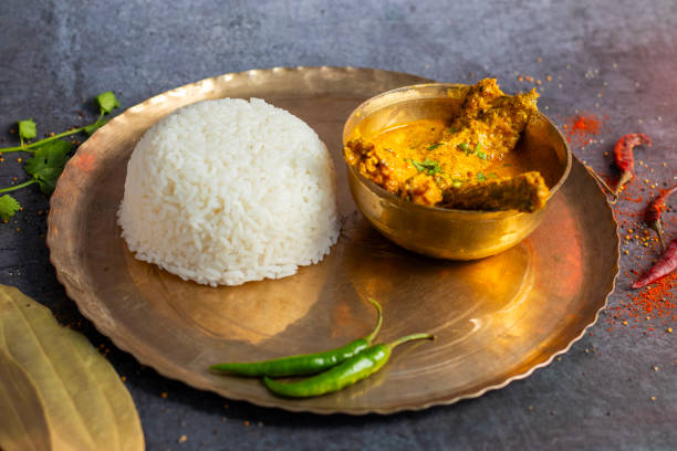 istock Pabda fish curry is a traditional Bengali dish, featuring tender pabda fish simmered in a spicy, mustard-based gravy. 2171442006