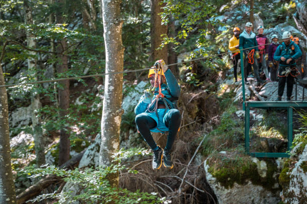 istock Young Black Adventurer Ziplining Through A Tranquil Forest And Embracing Freedom 2171442732