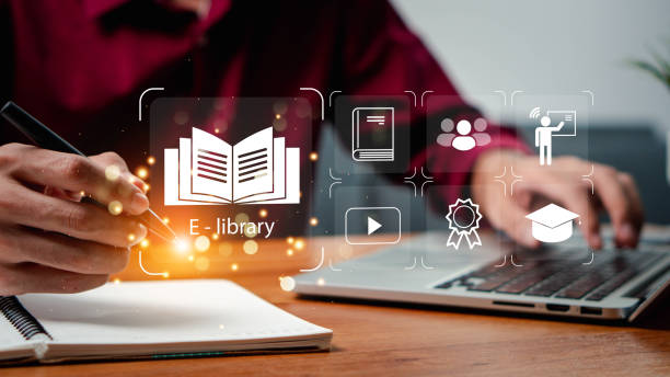 istock E-library concept. Person use laptop with virtual E-book icons for electronic books online, knowledge base on internet, digital library or e-library. Internet e-learning lessons and online 2171443050